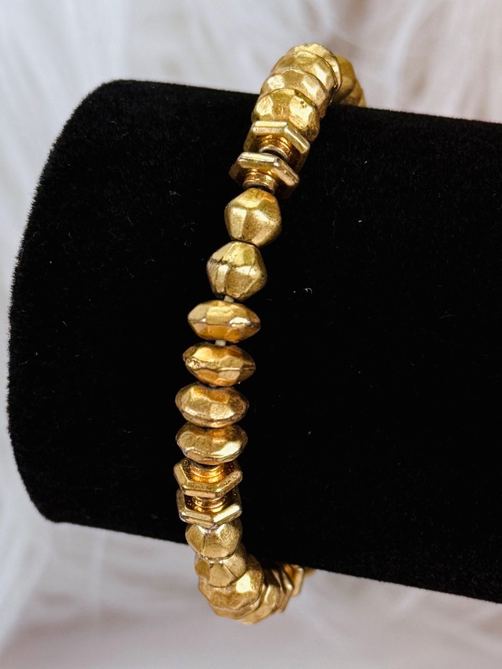 Pretty aged goldtone, weighted Stella & Dot stretch bracelet
